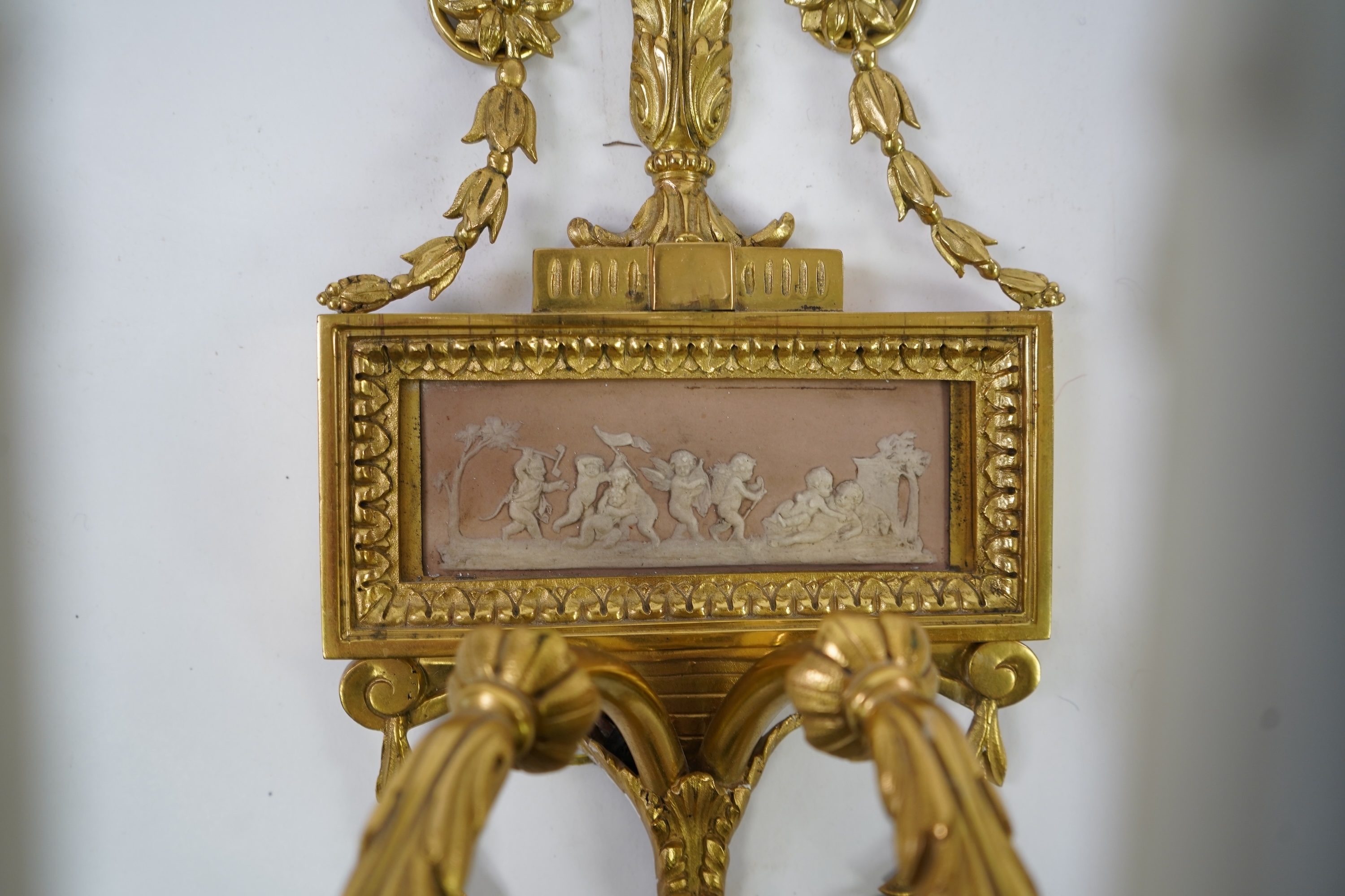 A set of four Adam style ormolu and jasper ware mounted wall appliques, early 20th century